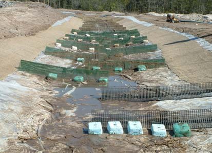 APS Floc Logs secured in a plastic-lined ditch mixing channel