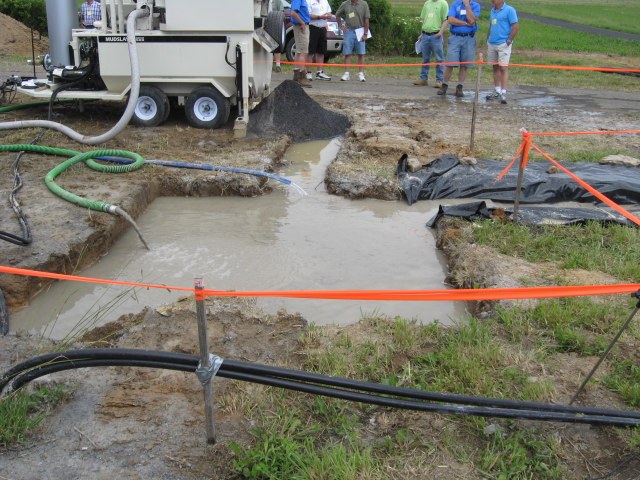 Settling pit and field demo area for geothermal well discharge treatment